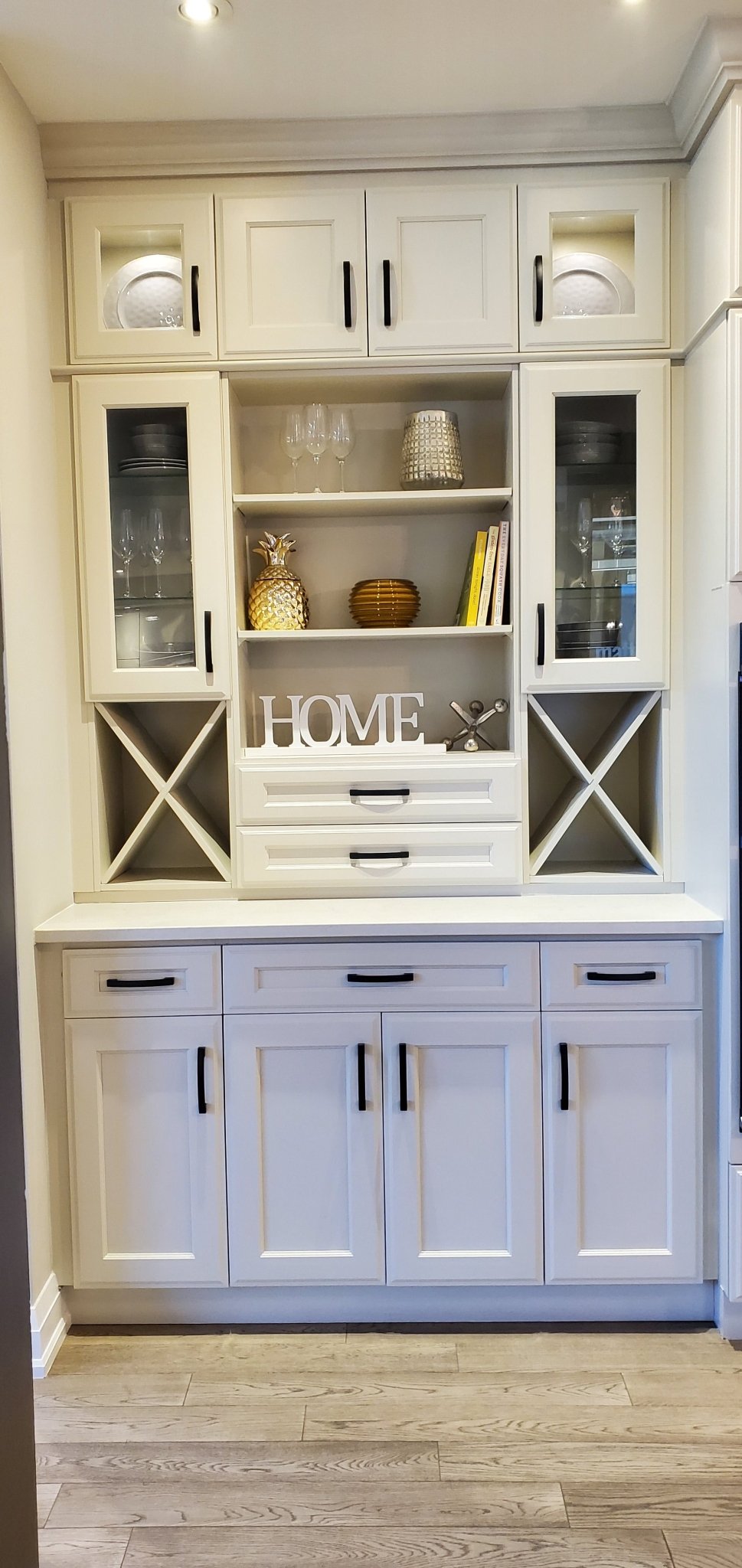 White wooden HOME sign displayed on shelf