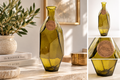 Faceted olive green glass vase with a narrow neck and a round kraft paper label, shown in a styled interior setting with a side panel showing alternate views.