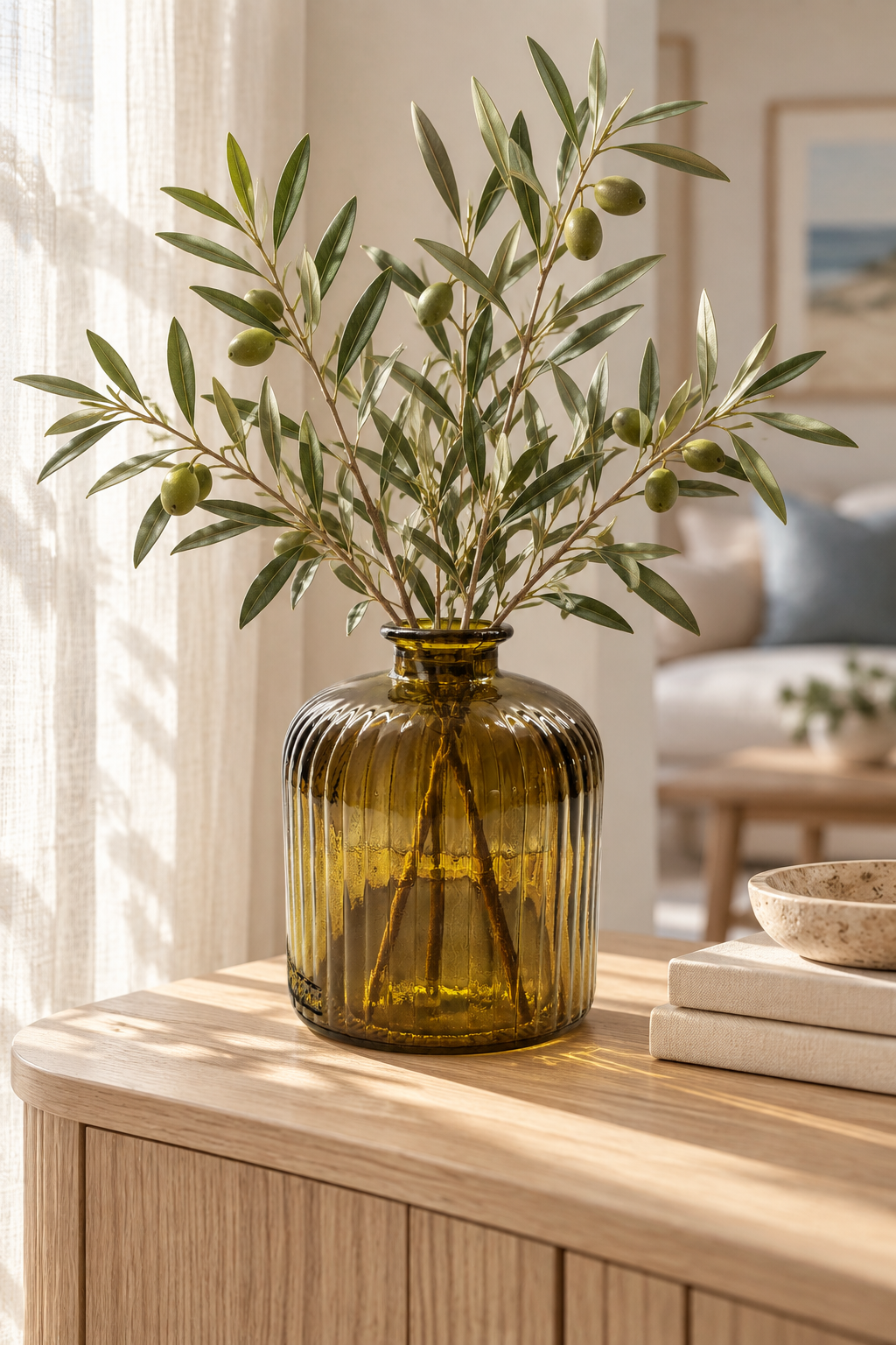 vase staged in a warm modern-coastal setting with olive branches, natural oak, soft linen, and neutral décor.