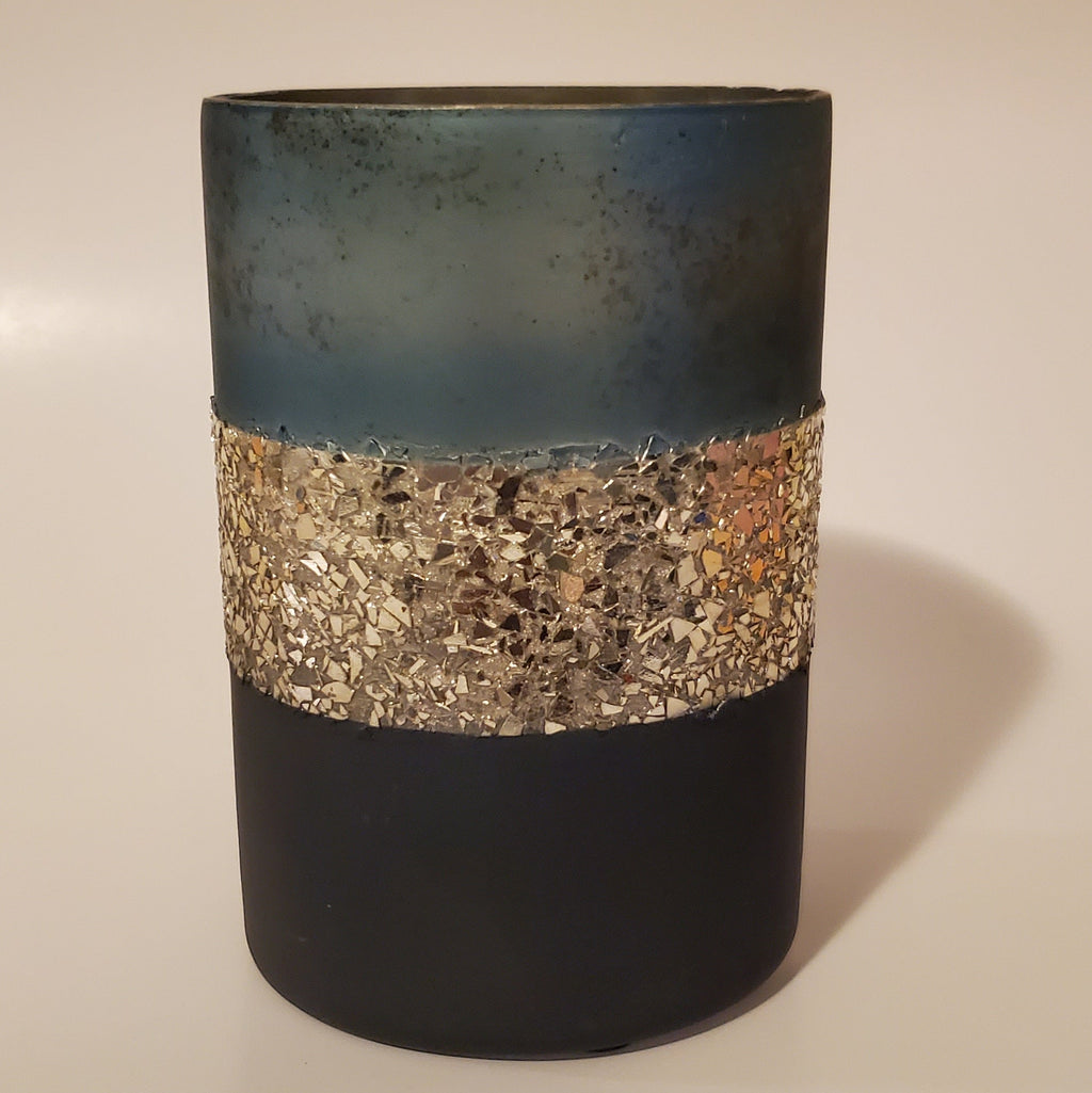 Two-toned blue and gold glass candle holder for elegant home décor warm light view
