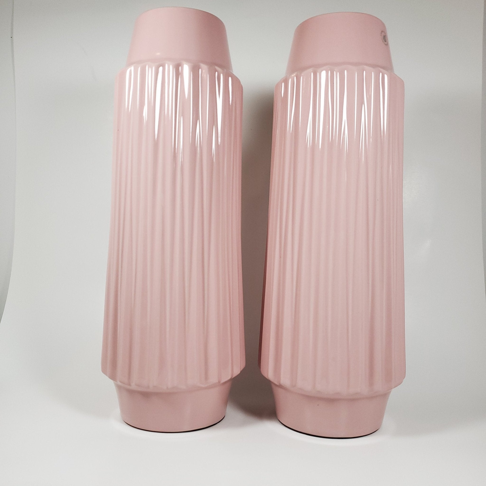 Blush pink ribbled ceramic vase showing pair