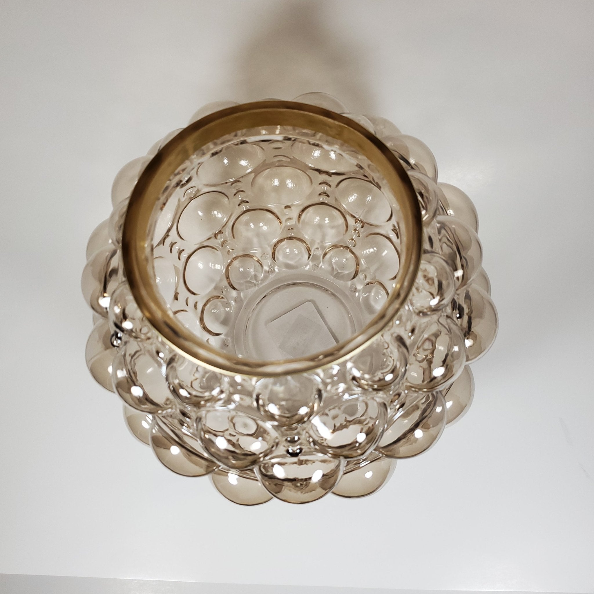 Bubble glass vase with gold rim top view