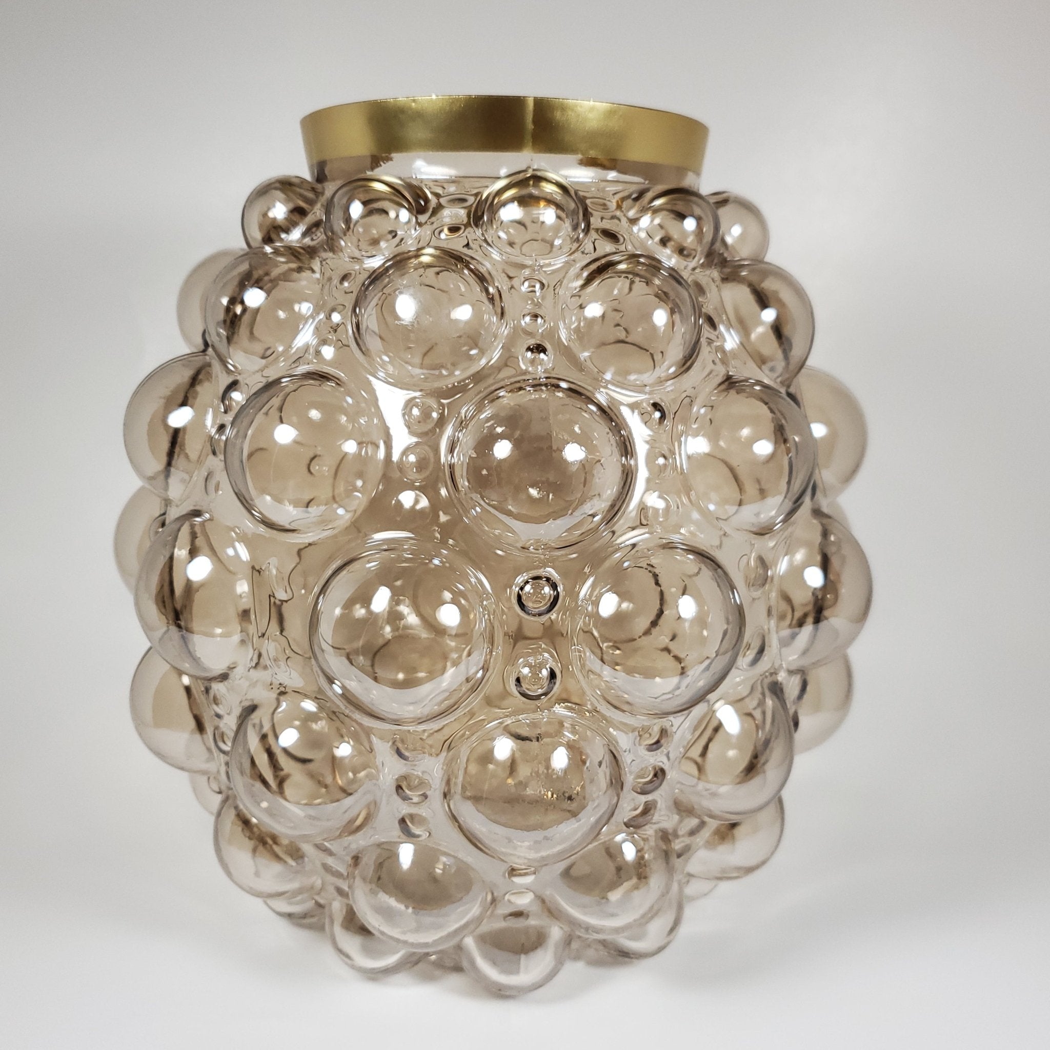 Bubble glass vase with gold rim zoomed in front view