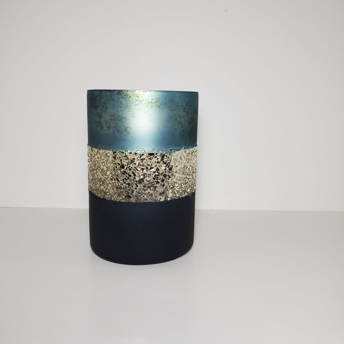 Two-toned blue and gold glass candle holder for elegant home décor distant view