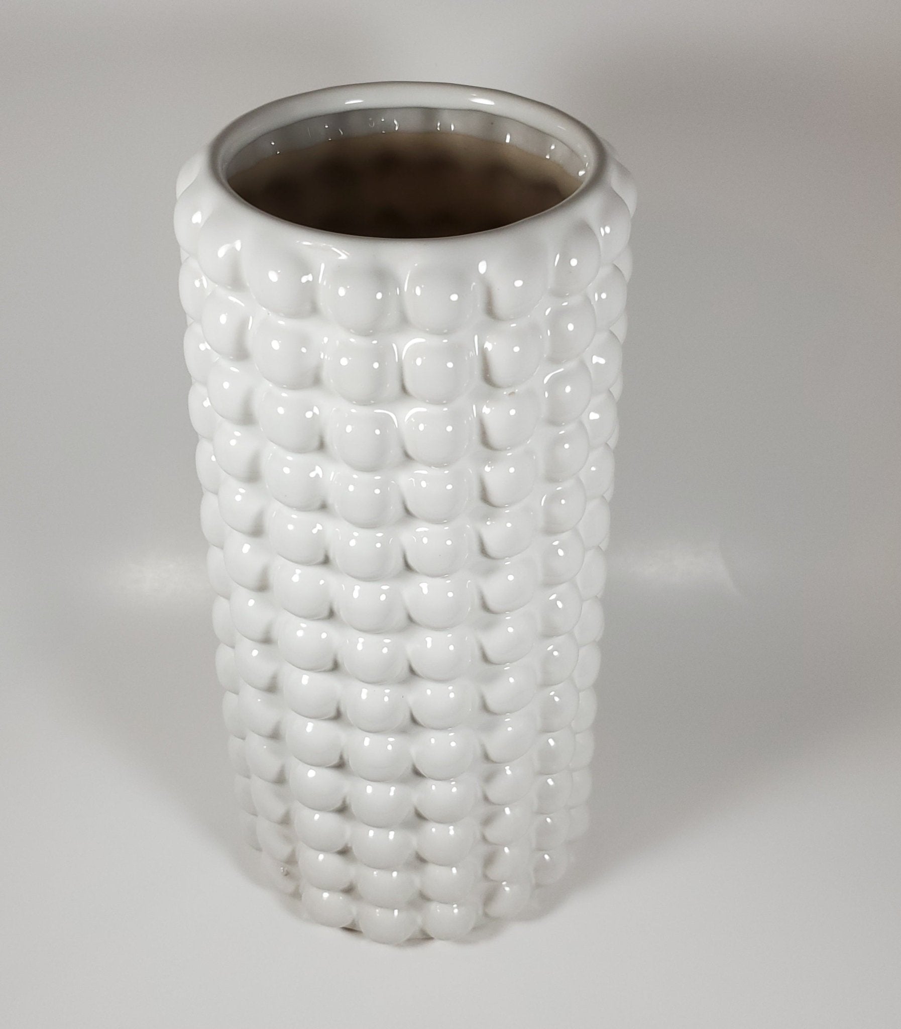 White bubble ceramic vase angled top view